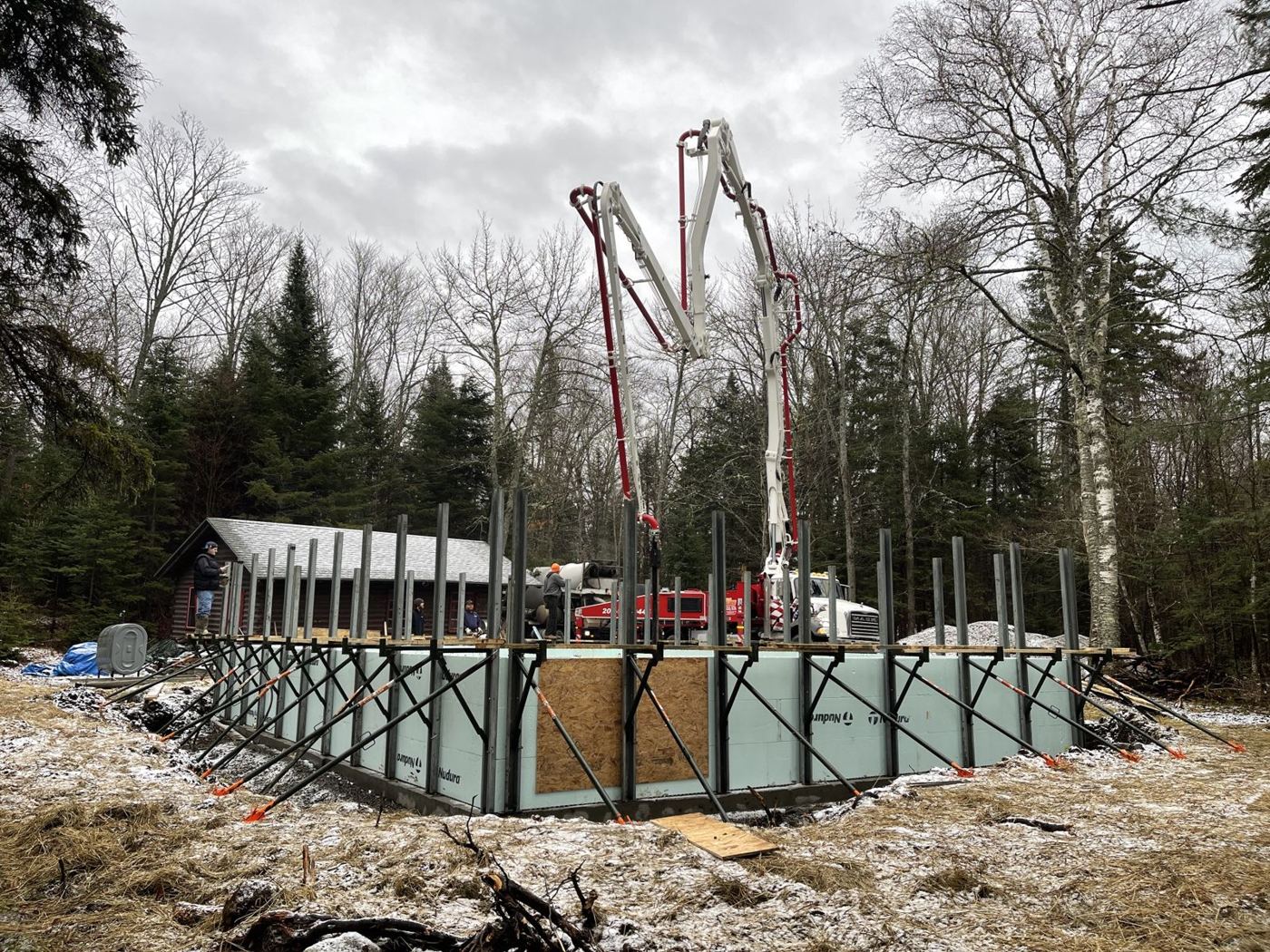 Concrete pump filling ICF foundation walls