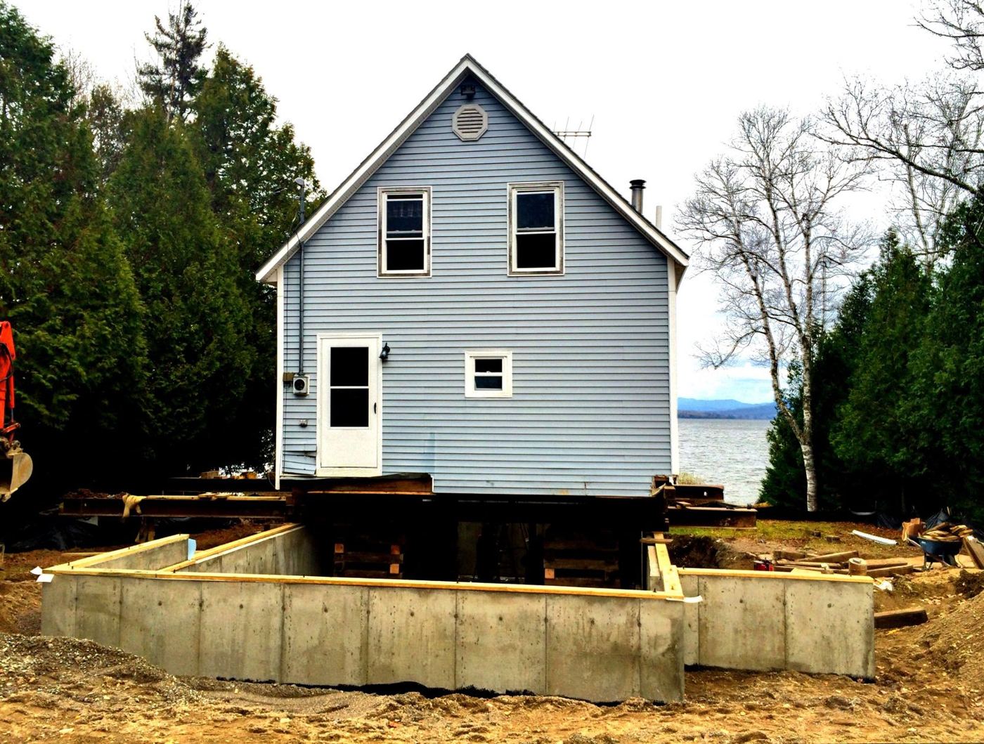 Lakeside camp raised above its new poured concrete foundation