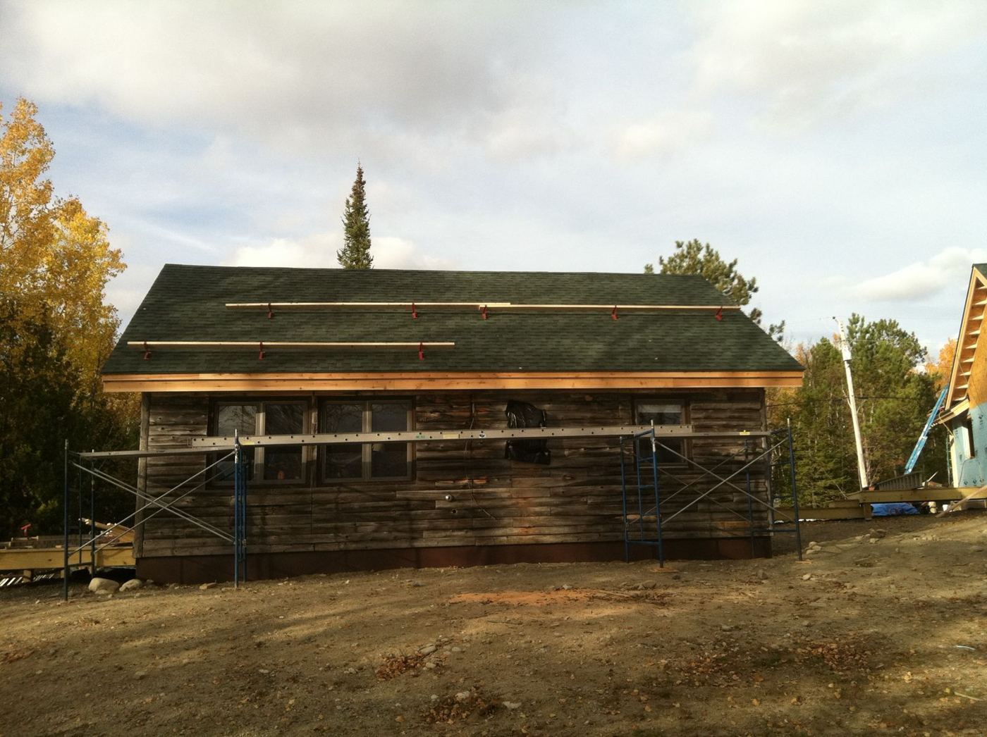The original log camp back down, with a new roof and fascia going on